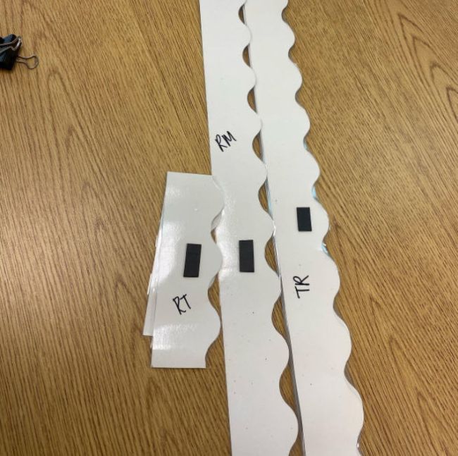 Whiteboard borders labeled on the back with their positions (Whiteboard Hacks)